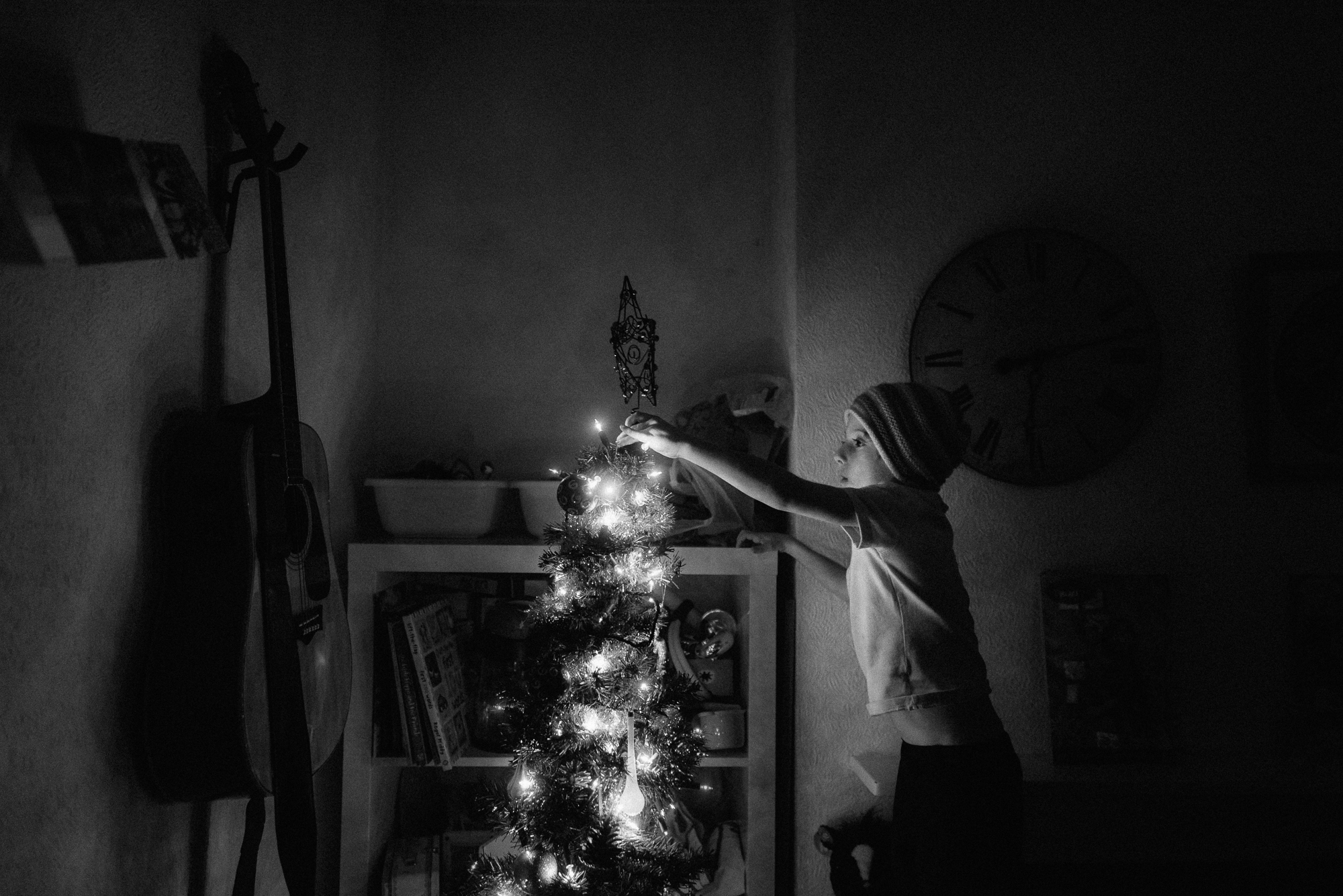 Putting the star on the Christmas tree - Christmas family photography